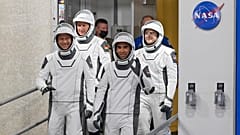 Astronauts, from left, Tom Marshburn, Matthias Maurer, of Germany, Raja Chari and Kayla Barron wave as they leave  for a trip to Launch Pad 39-A Wednesday, November 10, 2021.