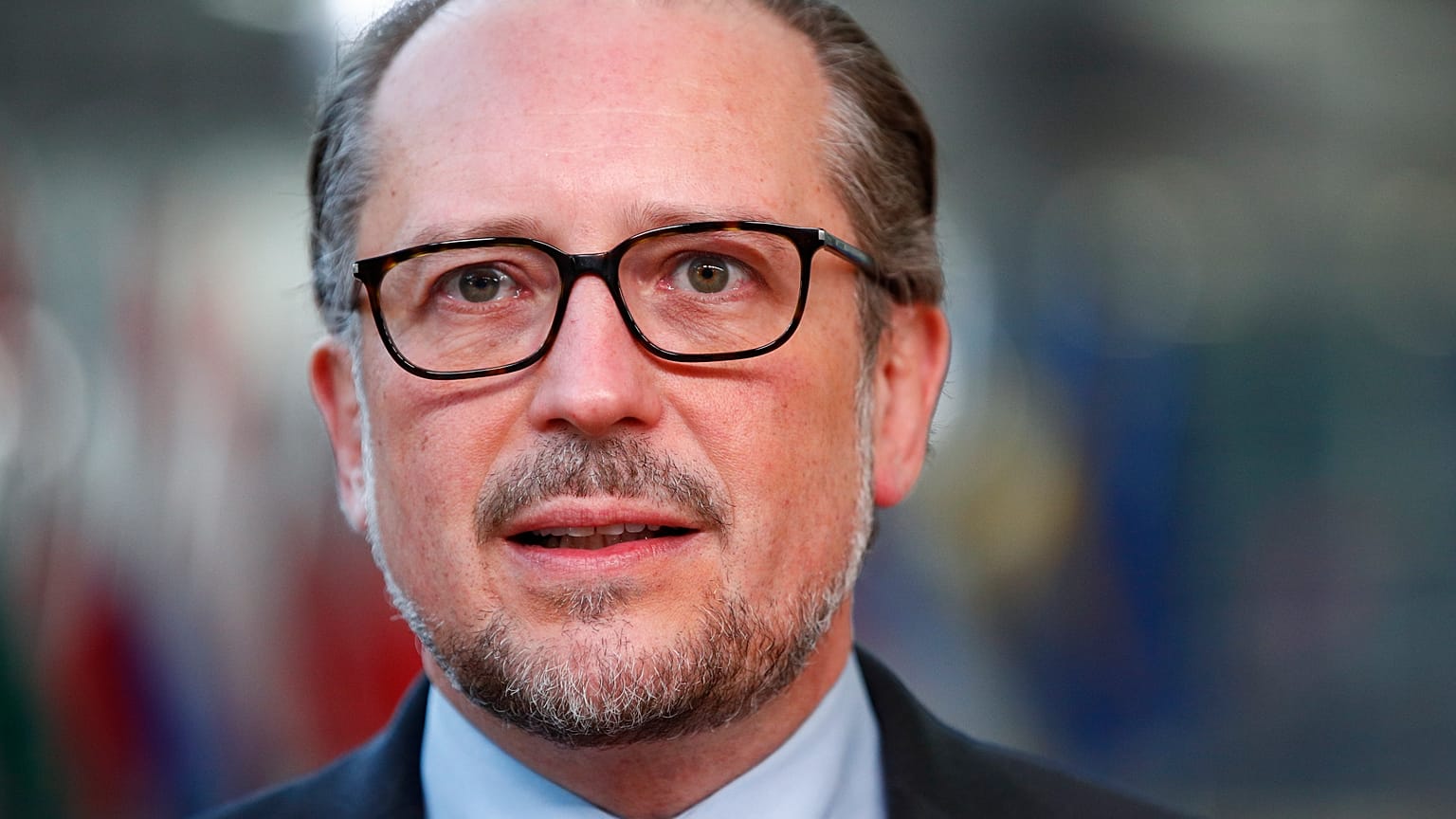 Austria's Chancellor Alexander Schallenberg talks to journalists as he arrives for an EU summit in Brussels, Oct. 22, 2021.
