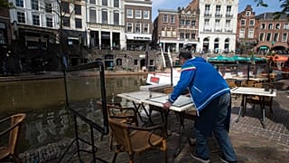 A restaurant opens up in Utrecht on April 28, 2021, as lockdown restrictions were eased. Such moves could now go into reverse due to rising coronavirus cases.