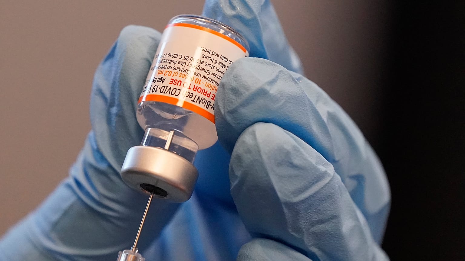 Paramedic Rebecca Hoke prepares a dose of the Pfizer-BioNTech COVID-19 vaccine in Fort Worth, Texas, Nov. 11, 2021.