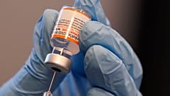 Paramedic Rebecca Hoke prepares a dose of the Pfizer-BioNTech COVID-19 vaccine in Fort Worth, Texas, Nov. 11, 2021.