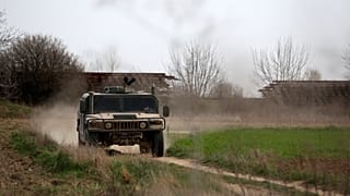 Greek army vehicle patrols at the Greek-Turkish border in the village of Kastanies, Evros region