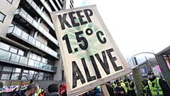 Climate activists take part in a demonstration outside the venue of the COP26 U.N. Climate Summit in Glasgow, Scotland, Friday, Nov. 12, 2021. 
