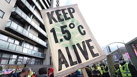 Climate activists take part in a demonstration outside the venue of the COP26 U.N. Climate Summit in Glasgow, Scotland, Friday, Nov. 12, 2021. 