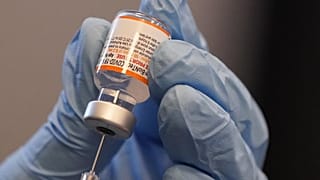 Paramedic Rebecca Hoke prepares a dose of the Pfizer-BioNTech COVID-19 vaccine in Fort Worth, Texas, Nov. 11, 2021.