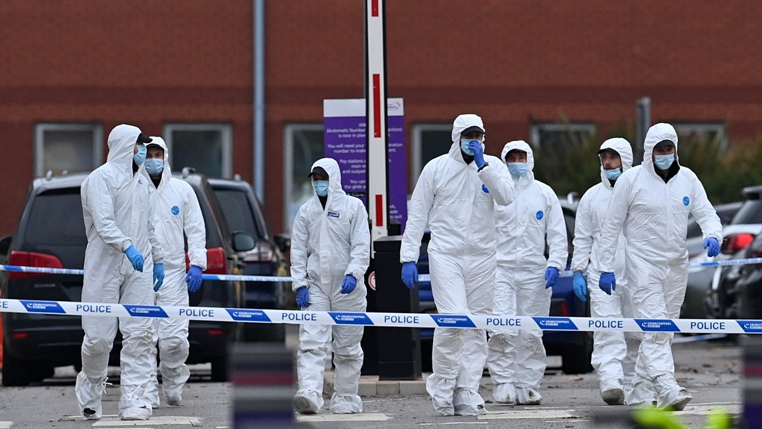 Police forensics officers start to depart after working outside the Women's Hospital in Liverpool on November 15, 2021, the scene of Sunday's taxi explosion. 