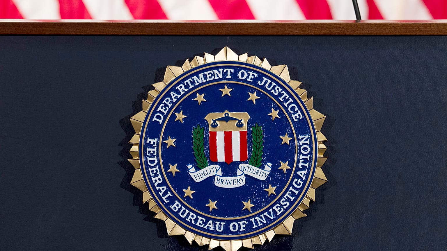 This June 14, 2018 file photo shows an FBI seal on a podium before a news conference at the agency's headquarters in Washington.
