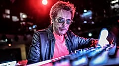 French composer and producer Jean-Michel Jarre poses on stage prior to perform a 2021 New Year's Eve virtual reality concert "Welcome to the other side"