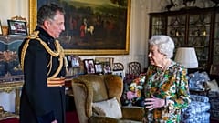 Queen Elizabeth II receives General Sir Nick Carter, Chief of the Defence Staff, left, during an audience in the Oak Room at Windsor Castle, Berkshire, Wednesday Nov. 17, 2021