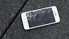 This Aug. 26, 2015 photo shows an Apple iPhone with a cracked screen after a drop test from the DropBot.
