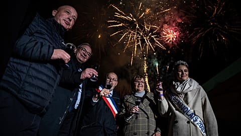 Mayor of Beaujeu Sylvain Sotton (C) takes part in the traditional event "the Sarmentelles" announcing the beginning of the "Beaujolais Nouveau" 2021 wine edition on 17/11/2021