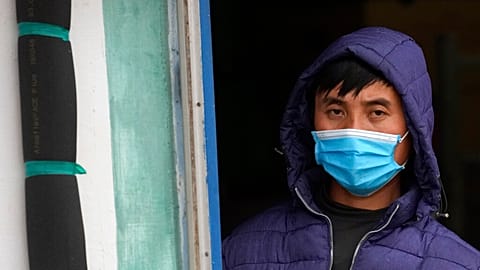 A Vietnamese worker looks on from a barracks described as "prison-like" in Zrenjanin, north of Belgrade, in November