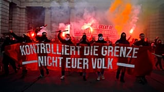 Demonstrators shout slogans and light flares during a demonstration against measures to battle the coronavirus pandemic in Vienna, Austria, Saturday, Nov. 20, 2021.