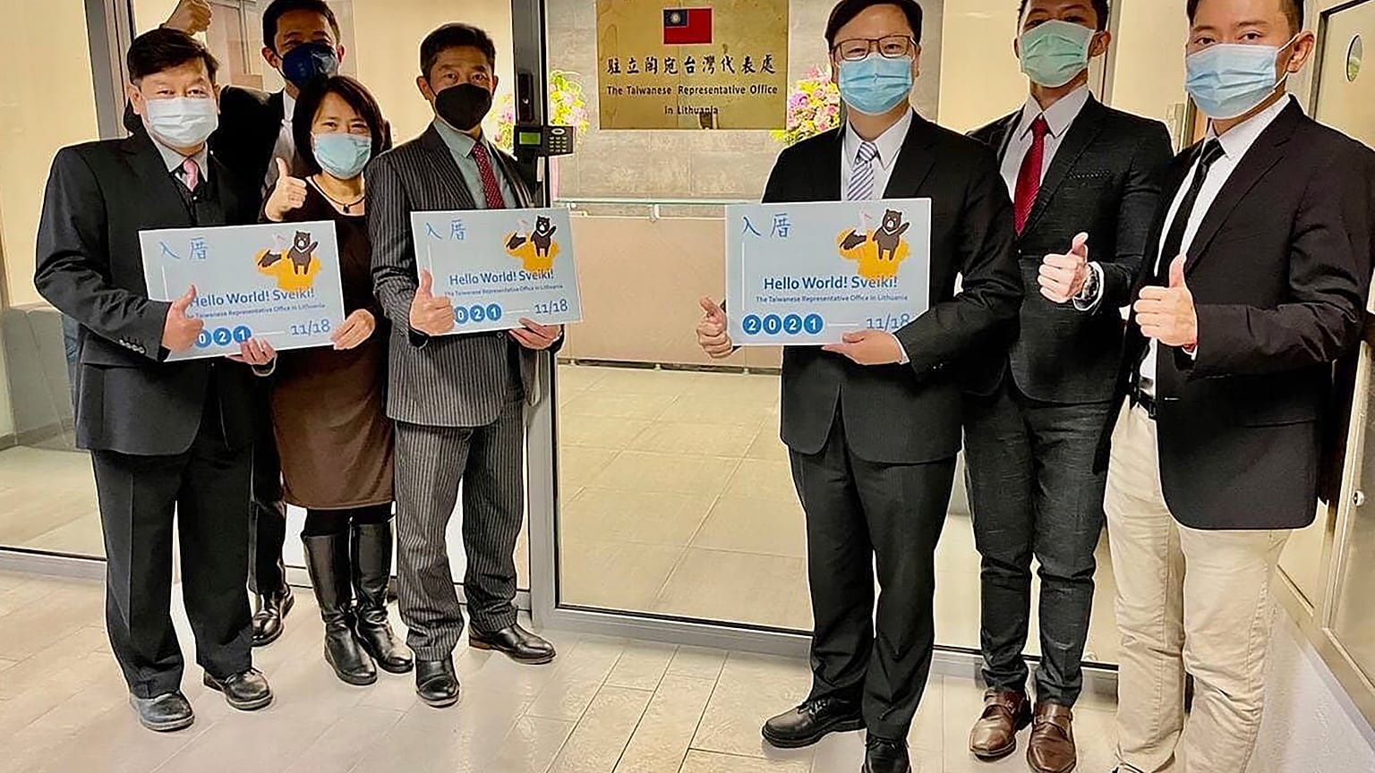  Eric Huang, newly appointed director to the representative office, third from right, poses with other staffers outside the Taiwan Representative Office in Vilinius, Lithuania