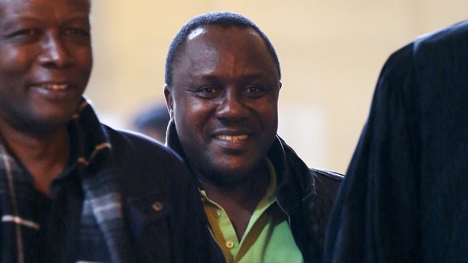 Claude Muhayimana (C), one of the two Rwandan men accused of taking part in the massacre of ethnic Tutsis during the Rwandan genocide in Paris, on November 13, 2013.