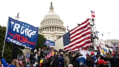 Violent insurrectionists loyal to President Donald Trump stand outside the U.S. Capitol in Washington on Jan. 6, 2021