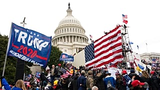 Violent insurrectionists loyal to President Donald Trump stand outside the U.S. Capitol in Washington on Jan. 6, 2021