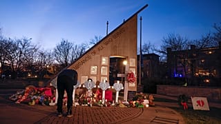 A memorial at Veteran's Park for the victims of Sunday's deadly Christmas parade crash in Waukesha