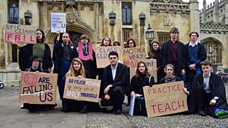 Cambridge University students present King's College with its 'U' grade on climate action.