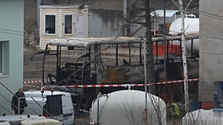 The burned out wreckage of the bus stored in a investigation service warehouse in the town of Pernik.
