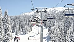 People travel in a ski lift 