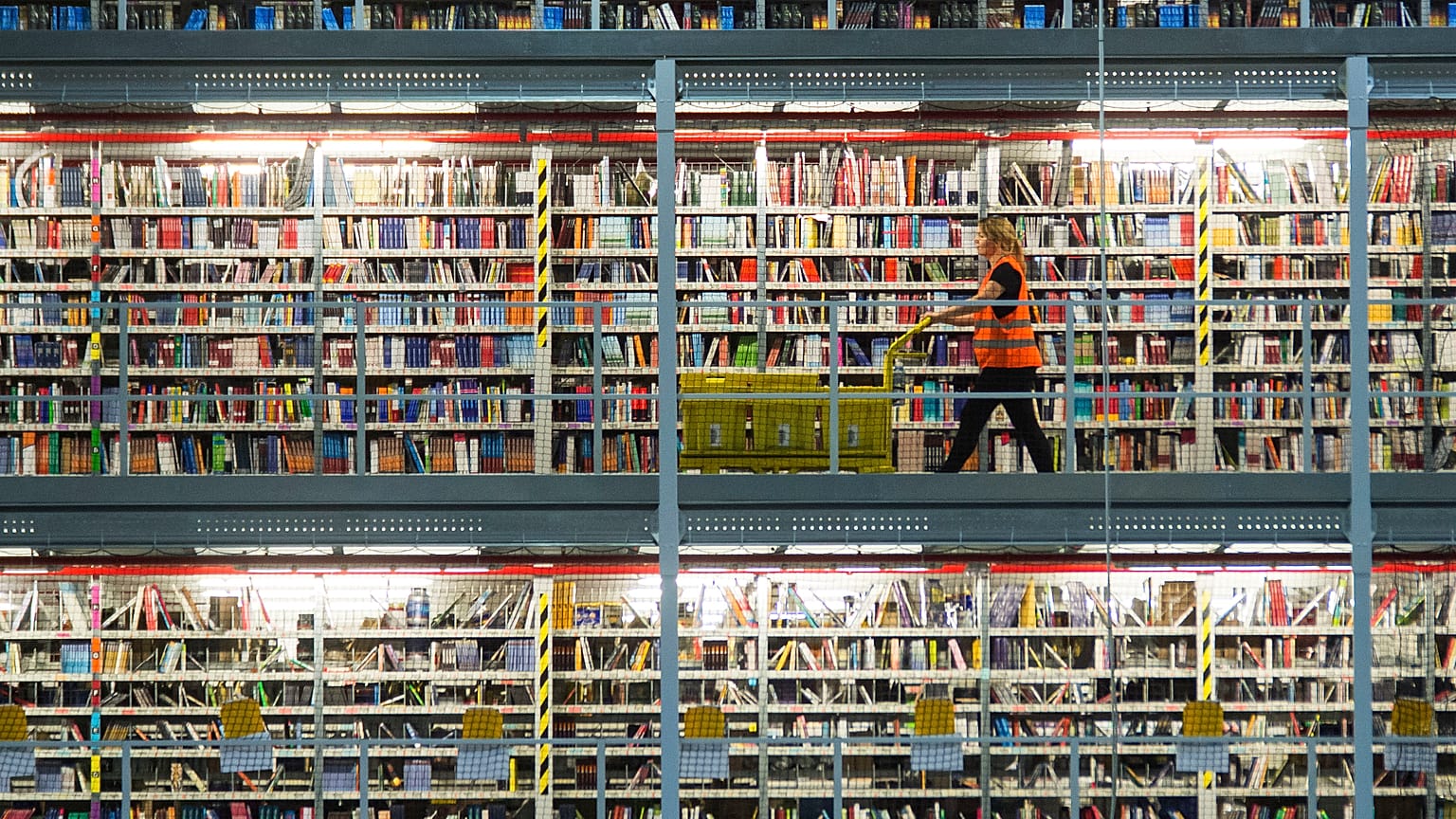In this Nov. 19, 2015 file photo an employee works in the distribution center of the online retailer Amazon in Leipzig, central Germany.