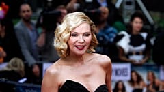 Kim Cattrall poses for photographers at the British premiere of "Sex and the City 2" in London, 2010. 