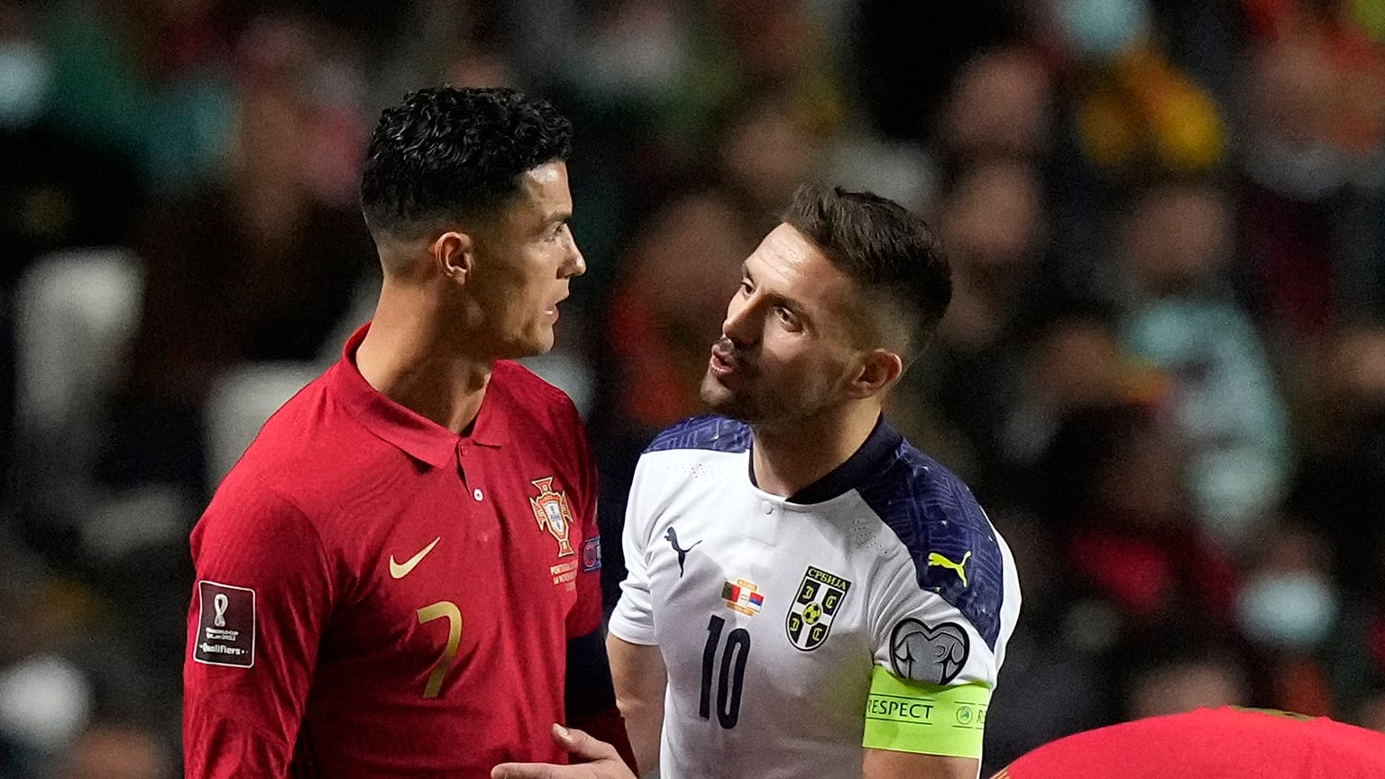 Portugal's Cristiano Ronaldo, left, with Serbia's Dusan Tadic during the World Cup 2022 group A qualifying football match in Lisbon, Nov 14, 2021.
