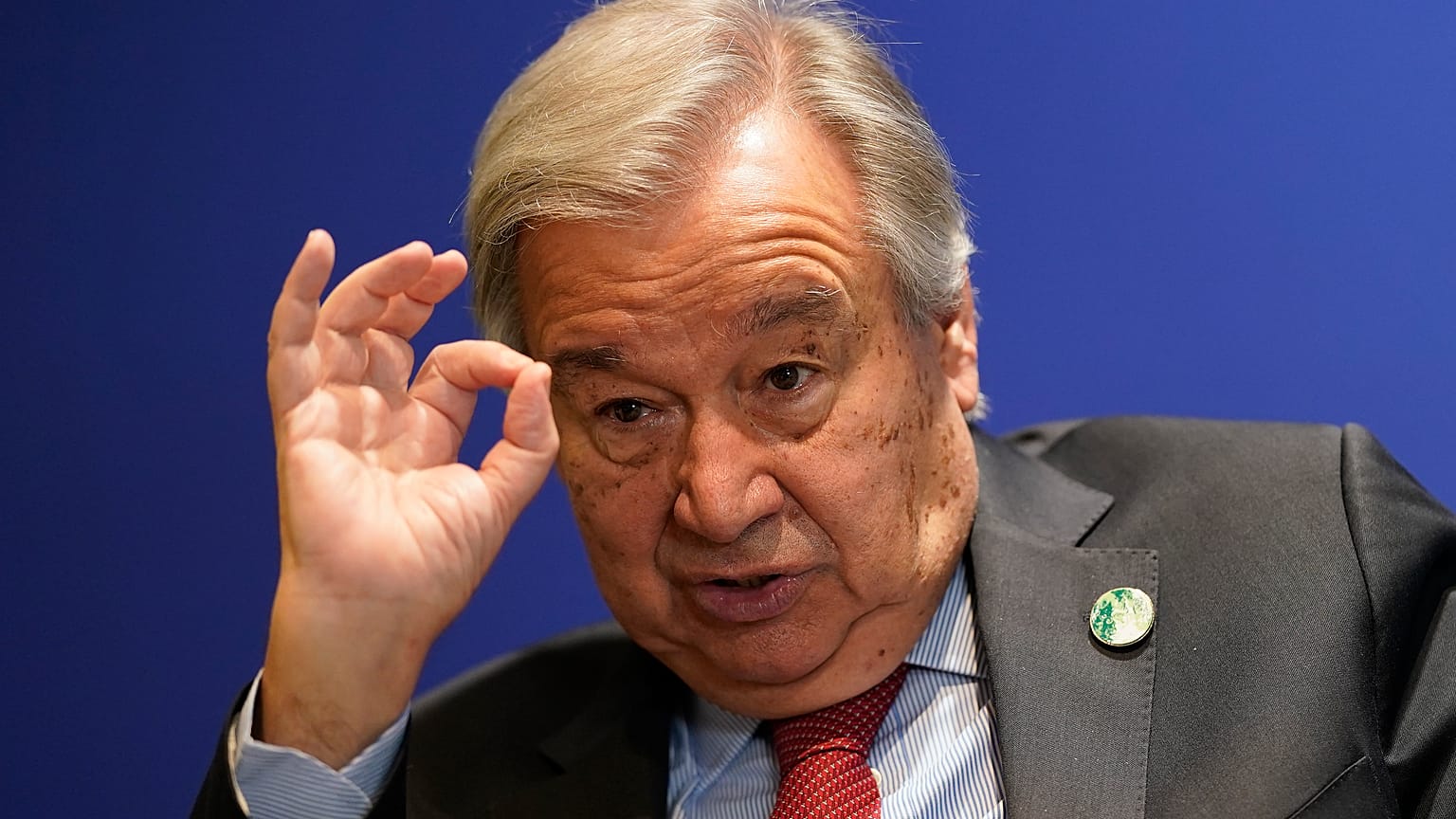 UN Secretary-General Antonio Guterres gestures during an interview at the COP26 U.N. Climate Summit in Glasgow, Scotland, Thursday, Nov. 11, 2021