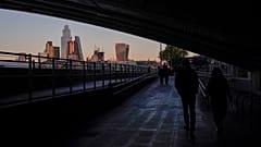 The skyline of the financial district known as The City, is seen as the sun sets in London, Nov. 23, 2021.