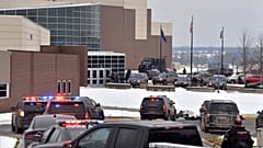 Dozens of police, fire, and EMS personnel work on the scene of a shooting at Oxford High School, Tuesday, Nov. 30, 2021, In Oxford Township, Mich.