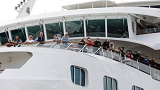 A luxury liner docked in Cape Town yesterday, as the WHO updated its travel advice.