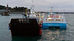 French fishing boats with Normandy Trader at left block the entrance to the port of Saint-Malo, western France, Friday, Nov. 26, 2021. 