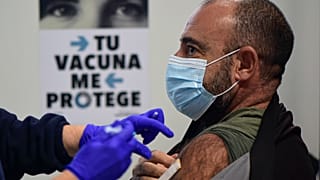 A man receives a shot of the Moderna vaccine, part of a COVID-19 vaccination campaign, in San Sebastian, northern Spain, Thursday, Dec. 2, 2021