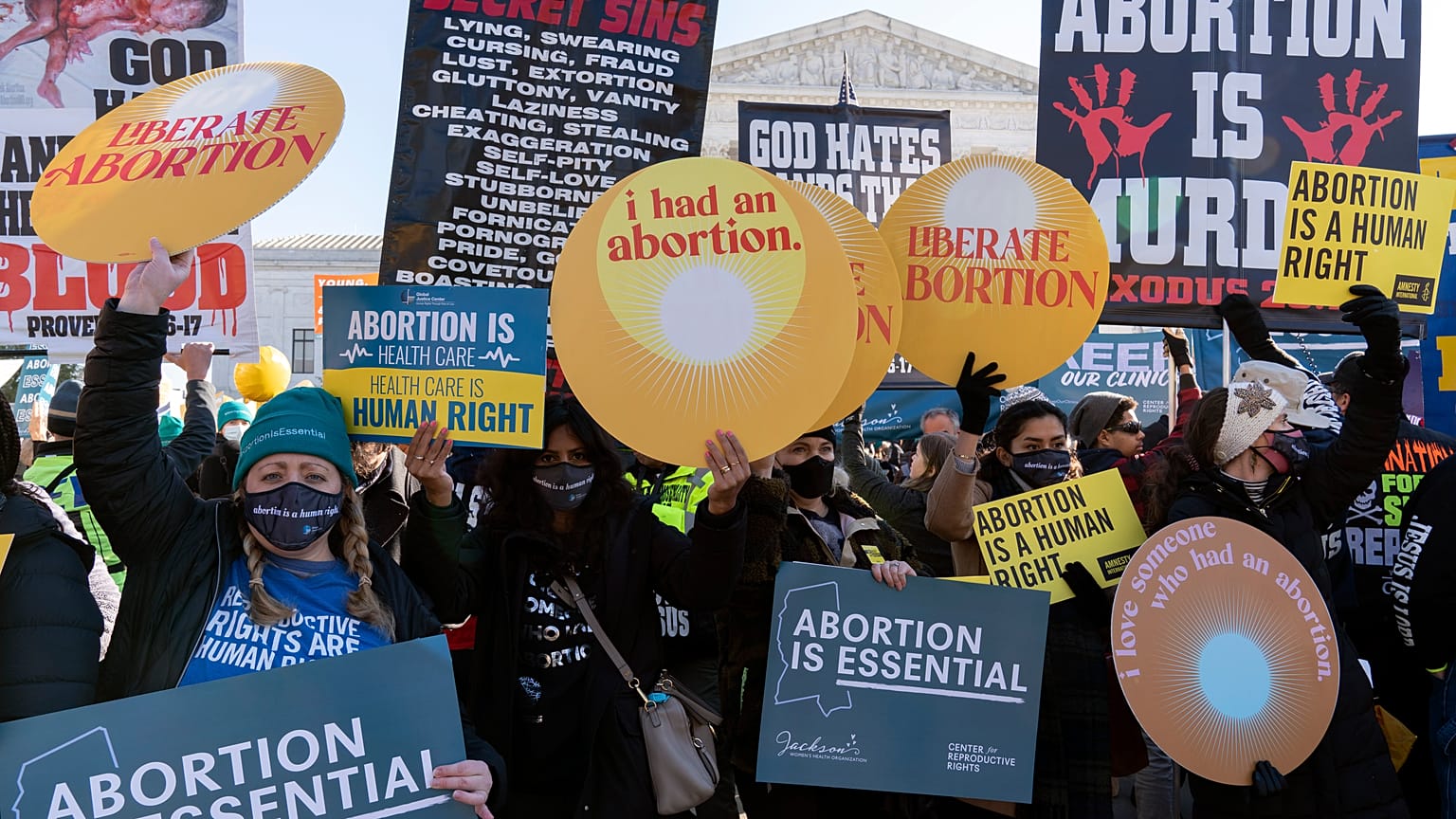 Anti-abortion and Abortion rights advocates demonstrate in front of the U.S. Supreme Court Wednesday, Dec. 1, 2021, in Washington.