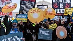 Anti-abortion and Abortion rights advocates demonstrate in front of the U.S. Supreme Court Wednesday, Dec. 1, 2021, in Washington.