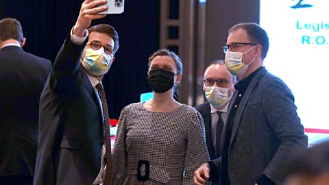 Matas Maldeikis, second from right, poses for a photo with group members before the 2021 Open Parliament Forum in Taiwan.