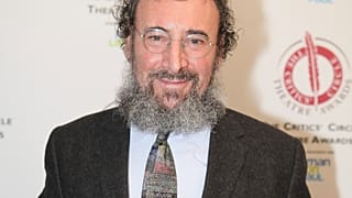 Antony Sher poses for photographers after winning the best Shakespearean performance award at the Critics' Circle Theatre Awards in central London Jan. 27, 2015