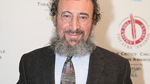 Antony Sher poses for photographers after winning the best Shakespearean performance award at the Critics' Circle Theatre Awards in central London Jan. 27, 2015