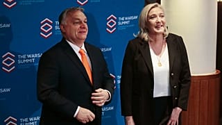French far-right leader Marine Le Pen and Hungarian Prime Minister Viktor Orban pose before a meeting of nationalist leaders in Warsaw, Poland, Saturday, Dec.4, 2021.