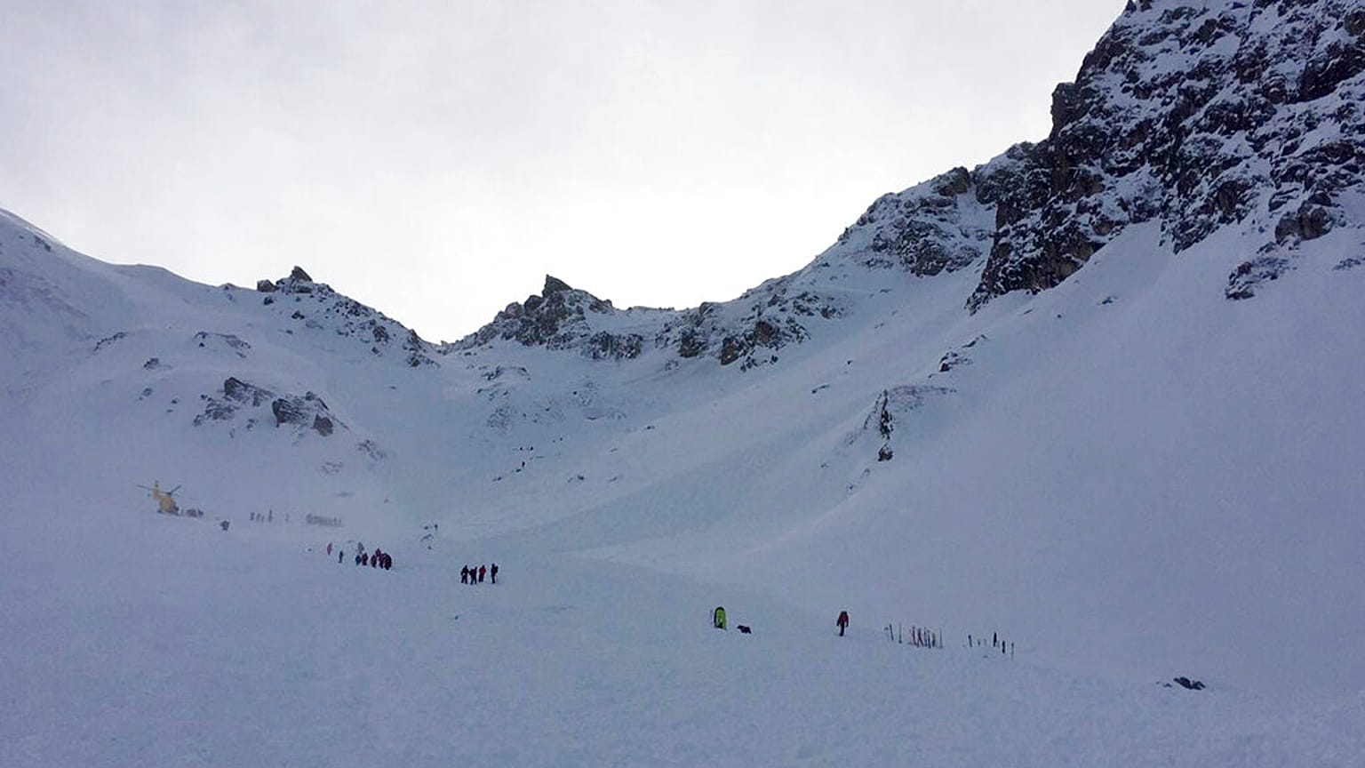 FILE: Mountain rescue service personnel search for skiers who were trapped in an avalanche in a valley of the Tyrolian municipality of Wattenberg, Austria, Feb. 6, 2016
