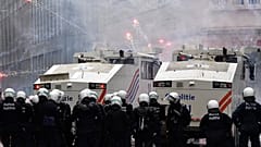 Demonstrators light fireworks during a protest against coronavirus measures in Brussels, Belgium, Sunday, Dec. 5, 2021.