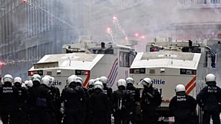 Demonstrators light fireworks during a protest against coronavirus measures in Brussels, Belgium, Sunday, Dec. 5, 2021.
