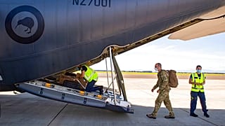 In this image released by the New Zealand Defense Force, crew prepare to depart on a C-130 Hercules from Ohakea, New Zealand, Dec. 2, 2021, bound for Solomon Islands.