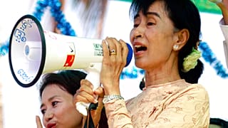 Myanmar pro-democracy icon Aung San Suu Kyi speaks to her supporters during her election campaign in Myeik, Myanmar on March 24, 2012.