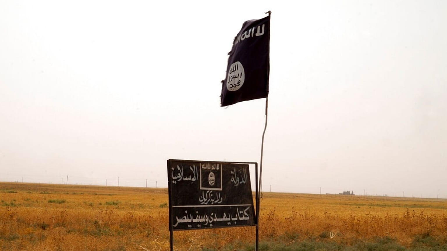 Islamic State flag in an area after peshmerga regained control of some villages west of Kirkuk