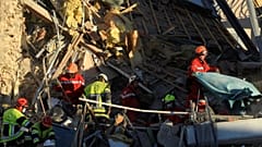 French firefighters search the rubble for missing inhabitants after a building collapsed in Sanary-sur-Mer, on December 7, 2021.