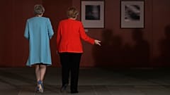 German Chancellor Angela Merkel, right, and British Prime Minister Theresa May leave after statements prior to a meeting in the chancellery in Berlin, Germany, on July 5, 2018