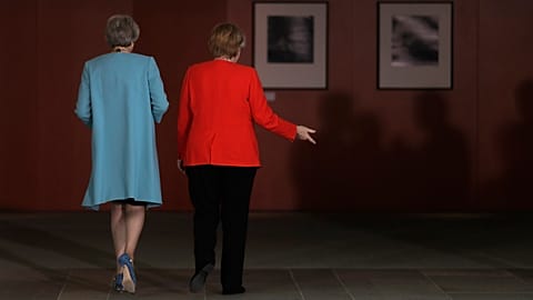 German Chancellor Angela Merkel, right, and British Prime Minister Theresa May leave after statements prior to a meeting in the chancellery in Berlin, Germany, on July 5, 2018