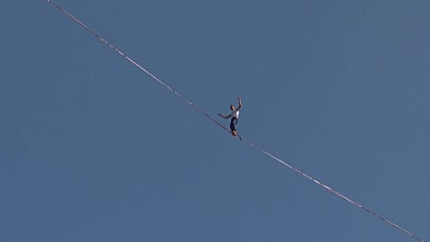 French daredevil Nathan Paulin walked between two hills 80m above Vermelha Beach